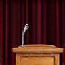 Podium and microphone representing literary event coverage
