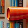 Megaphone and books representing author promotion